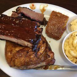 Smoking Pig BBQ - Three meat diner with pork spareribs, sliced brisket and chicken.