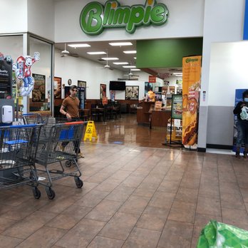 Walmart Supercenter - a woman pushing a shopping cart - Department Stores Near Me - Greer, South Carolina