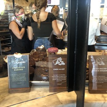 Sidecar Doughnuts & Coffee - Meant to take a picture of the doughnuts but inadvertently also captured employees ignoring customers. - Donuts Near Me - Costa Mesa, California