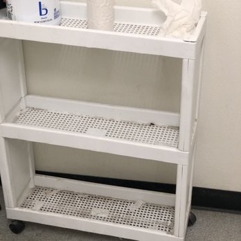CVS Pharmacy - a shelf with a dispenser and a roll of toilet paper - Drugstores Near Me - Norcross, Georgia
