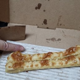a hand reaching for a piece of pizza a hand reaching for a piece of pizza