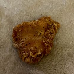 KFC - This is the dried out chicken nugget which was the size of a dime! No lie the tiniest chicken jerky I have ever eaten!!