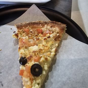 Fire And Dough - This is a piece of Jerusalem cheese with sesame seeds tomatoes and olives it is phenomenal - Pizza Near Me - North Olmsted, Ohio Fire And Dough - This is a piece of Jerusalem cheese with sesame seeds tomatoes and olives it is phenomenal - Pizza Near Me - North Olmsted, Ohio