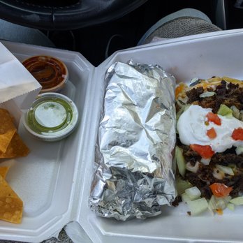 El Pitayo - Asada sope on the right, carnitas regular burrito, sauces and chips to go - Mexican Near Me - Fairfield, California