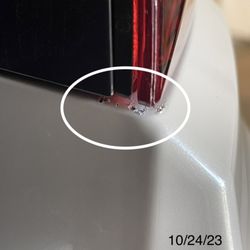 Certified Collision Center - Impressions/drags through all layers of paint: passenger side.
