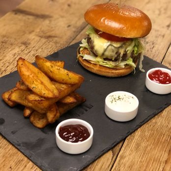 Black Rock Restaurant - Cherry smoked beef and pork shoulder burger, served with triple cooked chips and three dips. - Steakhouses Near Me - Clacton-on-Sea, ESS Black Rock Restaurant - Cherry smoked beef and pork shoulder burger, served with triple cooked chips and three dips. - Steakhouses Near Me - Clacton-on-Sea, ESS