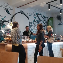 Ouroboros Wholefoods Cafe - Cool arty walls and amazing orchids next to a display of guilt free(well almost)cakes and energy balls to tempt you before you pay up