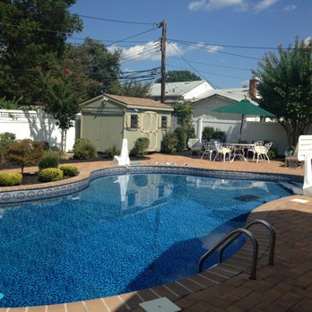 Molloy Landscaping - a pool and patio area - Landscaping Near Me - Farmingdale, New York Molloy Landscaping - a pool and patio area - Landscaping Near Me - Farmingdale, New York