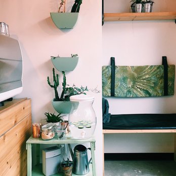 Les Impertinentes - a small kitchen with a microwave and a shelf - Juice Bars & Smoothies Near Me - Montreal, Quebec