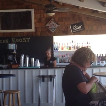 Black Pelican - That's the bar area on the ₽arty deck - Seafood Near Me - Kitty Hawk, North Carolina Black Pelican - That's the bar area on the ₽arty deck - Seafood Near Me - Kitty Hawk, North Carolina