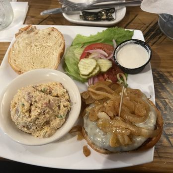 Blue Rooster Southern Grill - Sautéed onion burger with horseradish sauce and cornbread salad - American Near Me - Clyde, North Carolina
