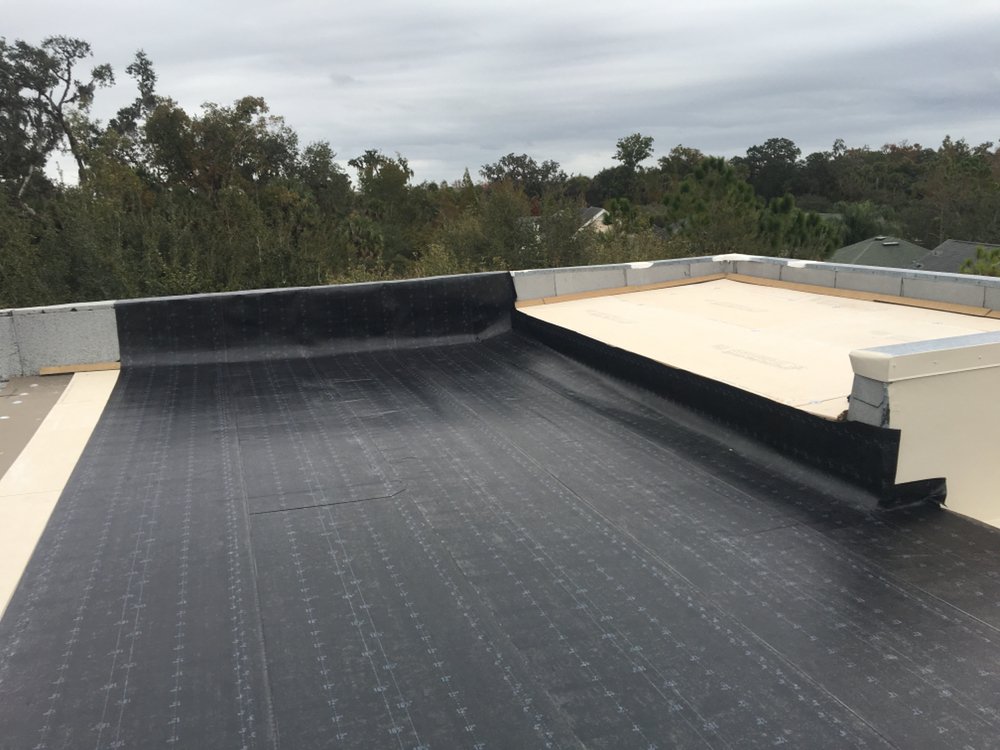 Slide of Zee's Roofing and Construction