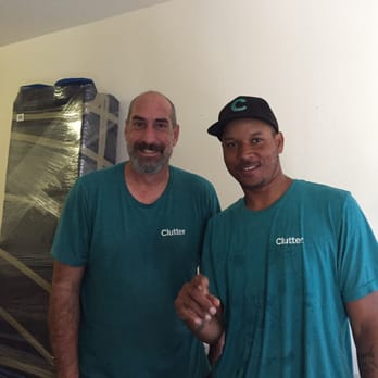 Clutter - Mike and Turean. Look how well the bookcase in the background is wrapped. - Self Storage Near Me