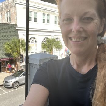 One Flight Up Cafe - Me sitting on balcony looking over downtown Mt Dora - Salad Near Me - Mount Dora, Florida