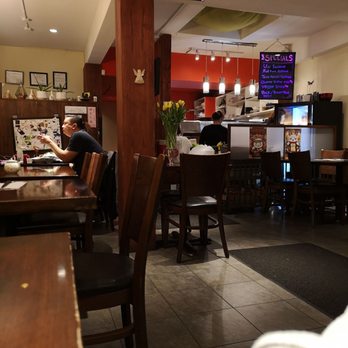 Ora Sushi - a man sitting at a table in a restaurant - Japanese Near Me - Richmond, British Columbia