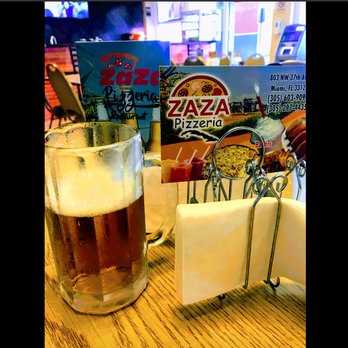 Zaza Pizza - a glass of beer and a box of pizza - Pizza Near Me - Miami, Florida Zaza Pizza - a glass of beer and a box of pizza - Pizza Near Me - Miami, Florida