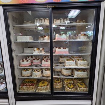 Herndon's Bodega & Bakery - a display of cakes - Bakeries Near Me - Herndon, Virginia Herndon's Bodega & Bakery - a display of cakes - Bakeries Near Me - Herndon, Virginia