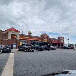 cars parked in front of a store cars parked in front of a store