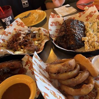 Phil's BBQ - Colossal Onion Rings, Sweet Baked Beans, Macaroni Salad, cornbread, Rib Only (Full) - Barbeque Near Me - San Diego, California Phil's BBQ - Colossal Onion Rings, Sweet Baked Beans, Macaroni Salad, cornbread, Rib Only (Full) - Barbeque Near Me - San Diego, California
