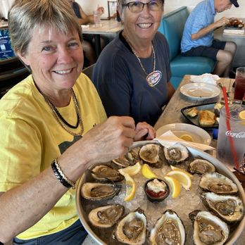 Dockside Waterfront Grill - People eating oysters - Seafood Near Me - Venice, Florida
