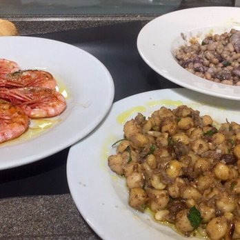 Pinotxo Bar - clockwise: grilled shrimp, baby squid and white beans, chickpeas - Spanish Near Me - Barcelona, B