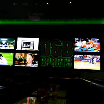 Dave & Buster's Euless - D & B Sports Bar dining room wall has 3 giant projection TV'S and 10 very big flat screen TV 's. - Arcades Near Me - Euless, Texas