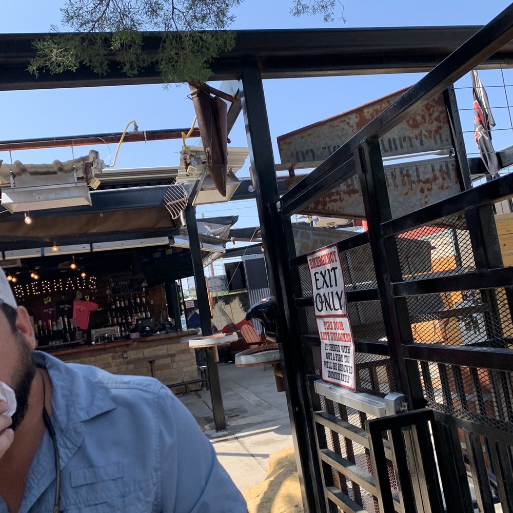 Bier Haus - a man eating a doughnut - Burgers Near Me - Lubbock, Texas Bier Haus - a man eating a doughnut - Burgers Near Me - Lubbock, Texas