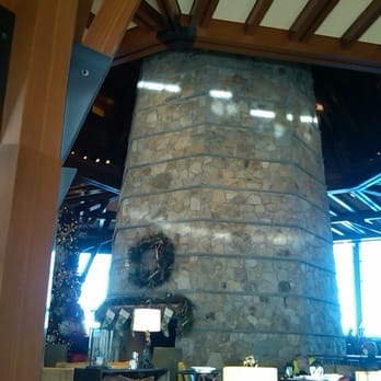 The Ritz - Carlton - a stone fireplace in a restaurant - American Near Me - Truckee, California The Ritz - Carlton - a stone fireplace in a restaurant - American Near Me - Truckee, California