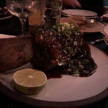 Ricardo's Hideaway - a plate of food on a table - Caribbean Near Me - Calgary, Alberta