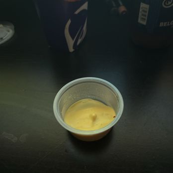 Taco Bell - This is my cup of cheese for my nacho fries. Maybe a 1/3 of a cup. Lazy people working there - Fast Food Near Me - Great Falls, Montana