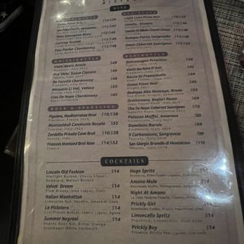 Amano Bistro - Drink Menu - The image shows a drink menu from Amano Bistro in Chicago, IL, listing various wine options, including Chardonnay, Rosé, and sparkling wines, along with cocktail choices such as Lincoln Old Fashion, Velvet Dream, and Prickly Girl. The menu also features beer options like Stella Artois and Lagunitas Little Sumpin. Prices are provided for each item, and the menu is organized into sections for wine, cocktails, and beer. - Italian Near Me - Chicago, Illinois