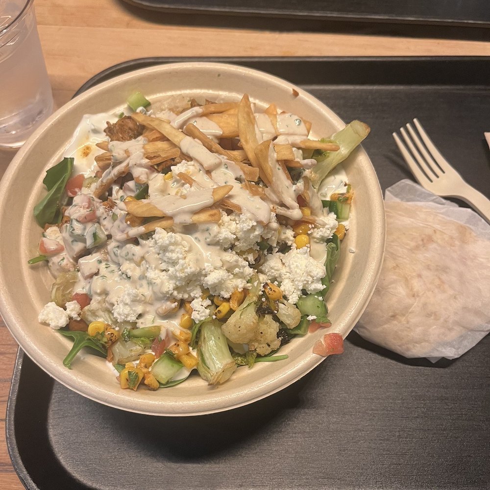 Greens and grain bowl with chicken and half veggies