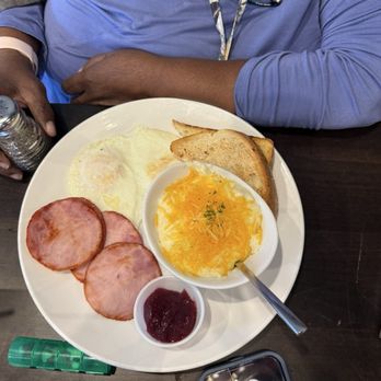 The Hudson Cafe - Two eggs, cheese grits, and Canadian bacon. - Breakfast & Brunch Near Me - Northville, Michigan The Hudson Cafe - Two eggs, cheese grits, and Canadian bacon. - Breakfast & Brunch Near Me - Northville, Michigan
