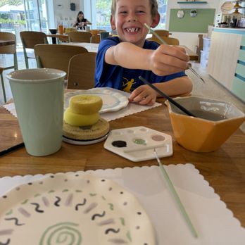 Color Me Mine - Seven-year old enjoying creating some art! - Paint-Your-Own Pottery Near Me - Culver City, California Color Me Mine - Seven-year old enjoying creating some art! - Paint-Your-Own Pottery Near Me - Culver City, California