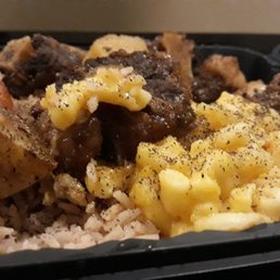 Oxtails platter with mac&cheese and rice with beans. Oxtails platter with mac&cheese and rice with beans.