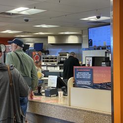 Dunkin' - Only staff member behind the counter at an airport location! Failure on management.