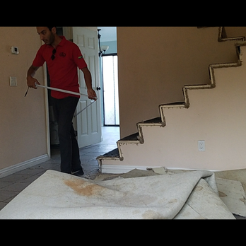Incredible Flooring - Sam (adore him!) doing his thing, measuring and manuevering around my previous flooring. - Carpeting Near Me - Orange, California