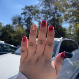 Burgundy and gold glitter dipped nails.