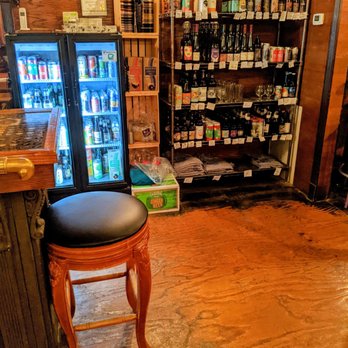 Safe House Saloon - Bar stool and selection of bottled beers - Pizza Near Me - Lansing, Iowa Safe House Saloon - Bar stool and selection of bottled beers - Pizza Near Me - Lansing, Iowa