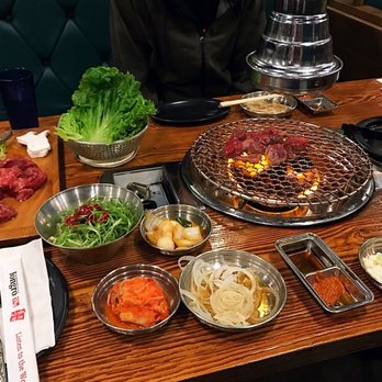 Jongro BBQ - banchan, sauces, salad, lettuce wraps and marinated onion go together with your cooked meat - Korean Near Me - New York, New York