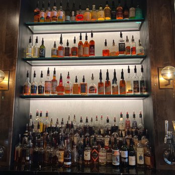 Ruin - a wall of liquor bottles in a bar - Lounges Near Me - Salt Lake City, Utah
