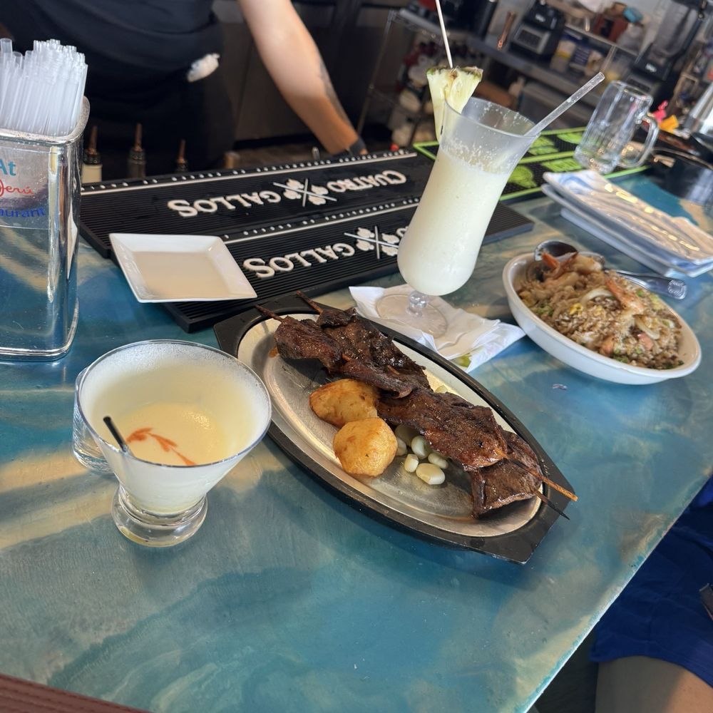 Hard to find traditional Peruano food... passion fruit pisco sour and pina colada... Anticucho (hard to find) and arroz Chaufa both A1