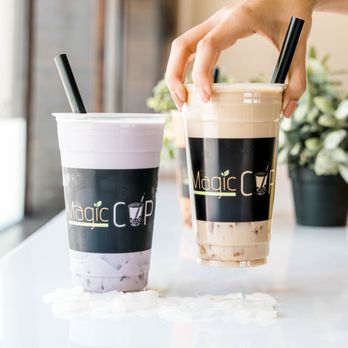 Magic Cup - a hand holding a straw and a cup of coffee - Bubble Tea Near Me - McKinney, Texas