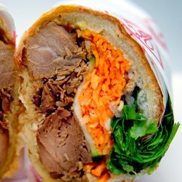 Lemongrass Chicken Bánh Mì : $14. Half shown. Lemongrass Chicken Bánh Mì : $14. Half shown.