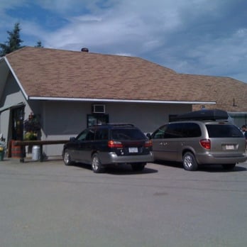 Grass Root Dairies - two vehicles parked in front of a building - Cheese Shops Near Me - Salmon Arm, British Columbia