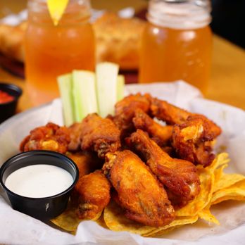 Beau Jo's - Evergreen - a plate of chicken wings and chips - Pizza Near Me - Evergreen, Colorado