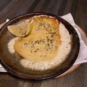 Vasili's - Saganaki Presentation needs some personality. The female waitress who bought this out said OOPA in the softest voice. - Mediterranean Near Me - Naperville, Illinois