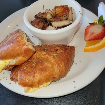 The Garden Brunch Cafe - Breakfast sandwich with turkey sausage and roasted red potatoes - Breakfast & Brunch Near Me - Memphis, Tennessee The Garden Brunch Cafe - Breakfast sandwich with turkey sausage and roasted red potatoes - Breakfast & Brunch Near Me - Memphis, Tennessee