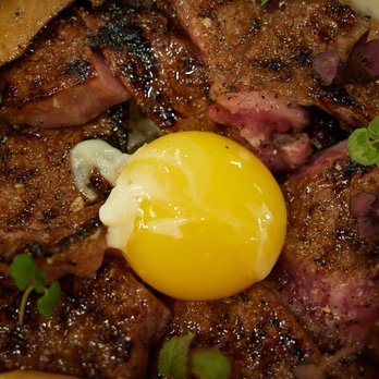 MĀZE - A5 Miyazaki ssam - Seasoned beef and mushrooms w/ cured edd yolk atop sesame rice - New American Near Me - Honolulu, Hawaii