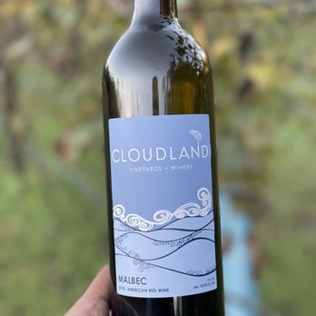 Cloudland Vineyards and Winery - a hand holding a bottle of wine - Wineries Near Me - Buford, Georgia Cloudland Vineyards and Winery - a hand holding a bottle of wine - Wineries Near Me - Buford, Georgia